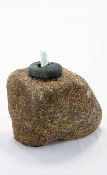 Brown granite stone tiki lamp with smooth texture and a small  round dark grey top stone holding  the wick.